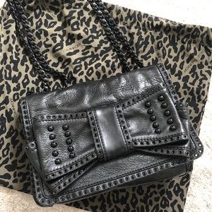 Rebecca Minkoff Sweetie bag. Black leather bow bag with grommets studs